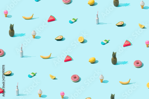 Trendy sunlight Summer pattern made with various summer food on bright light blue background. Minimal summer food concept. © Zamurovic Brothers