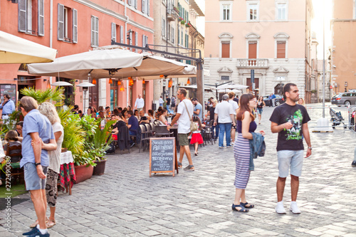 Fototapeta Naklejka Na Ścianę i Meble -  Ancona, Italy - June 8 2019: People enjoying summer day and food at outdoor restaurant and resting.