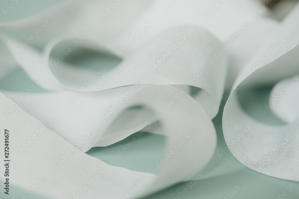 Soft Blue Ribbon On A Green Backdrop Soft Blue Ribbon On A Green Backdrop