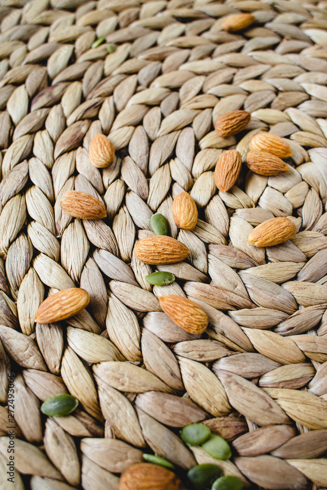 almonds nuts on a natural wicker napkin almonds nuts on a natural wicker napkin