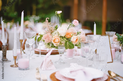 Elegant Outdoor wedding tabletop with florals