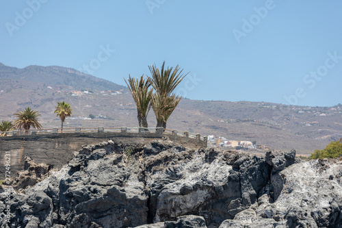 Beautiful rocks at beach with waves and blue water in Teneriffa