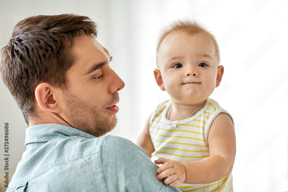 family, fatherhood and people concept - father with little baby daughter at home family, fatherhood and people concept - father with little baby daughter at home