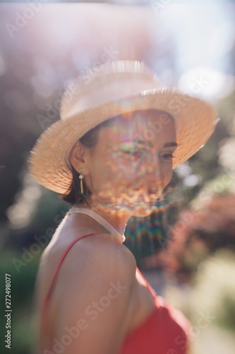 Lens baby portrait of lovely girl with rainbow sunbeam on her face photo