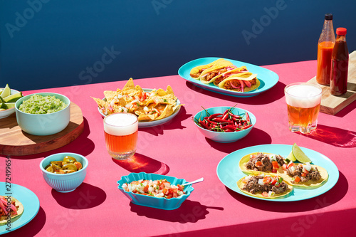 Party table with beer and Mexican food