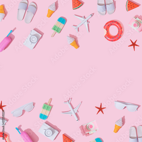 Creative composition made with various travel objects on pastel pink background. Summer vacation pattern.