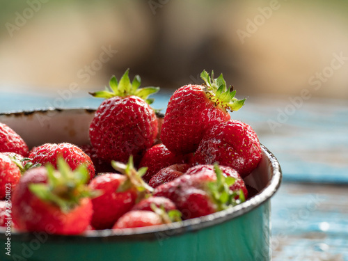 Fresh ripe strawberries from the garden in a bowl close-up