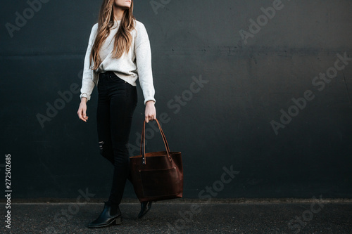 Woman carrying bag photo