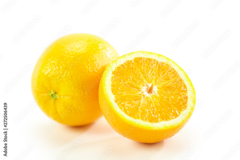 orange whole and half on white background orange whole and half on white background