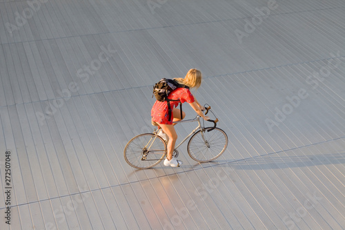 young woman on racing bike photo