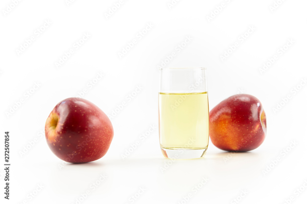 two apples and a glass of apple juice two apples and a glass of apple juice