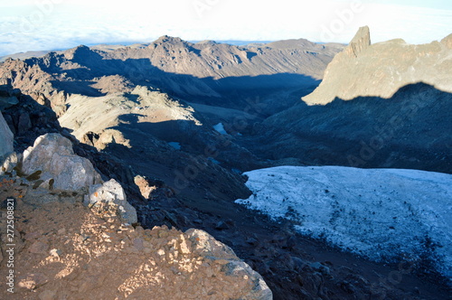 Volcanic rock formations above the clouds in the beautiful panoramic mountain landscapes of Mount Kenya