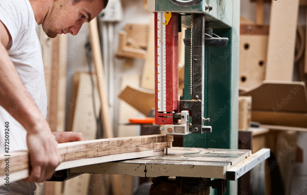 Woodworking: Man Uses Jig Saw to Cut Trim Piece Woodworking: Man Uses Jig Saw to Cut Trim Piece