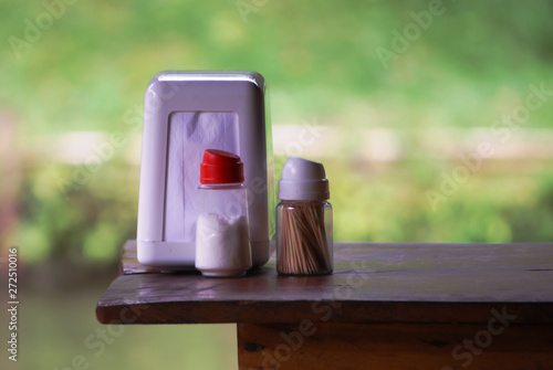 napkin holder, salt shaker and toothpick holder photo