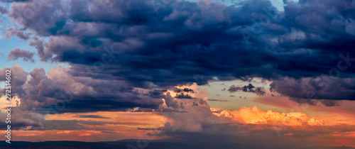 Dramatic light through the clouds against the backdrop of an exciting, bright stormy sky at sunset. panorama, natural composition © Юрий Кузнецов