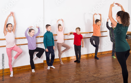 Group of children practicing at the ballet barre