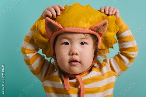 Portrait of toddler in lion costume photo