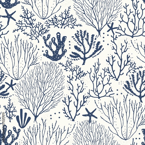 Seamless hand drawn pattern with coral reef and starfishes. Vector dark blue illustration on ivory background.