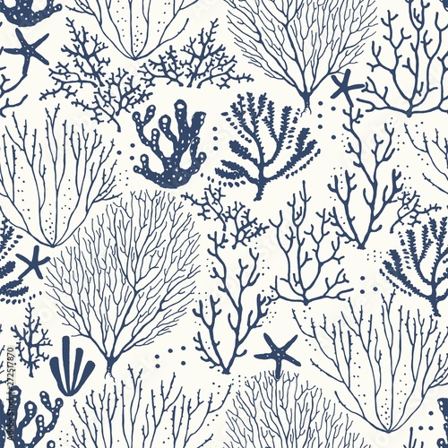 Seamless hand drawn pattern with coral reef and starfishes. Vector dark blue illustration on ivory background. photo