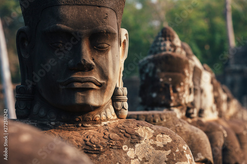 Stone Heads of Asuras in Angkor Wat photo