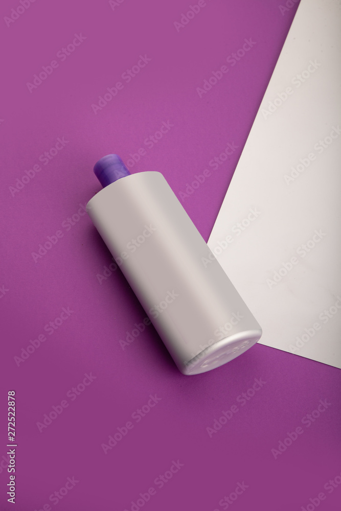 cosmetics shampoo bottles, tubes. Modern flat lay still life bundle on colorful frosted background. Skin or hair care. cosmetics shampoo bottles, tubes. Modern flat lay still life bundle on colorful frosted background. Skin or hair care.