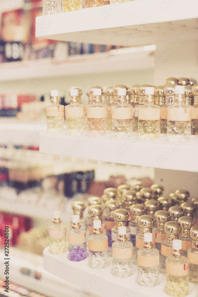 Bottles of perfume for sale on shelves