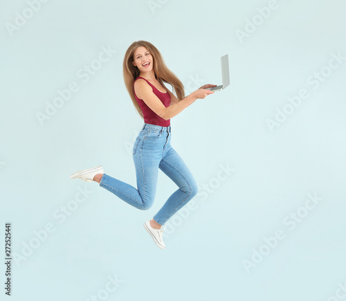 Beautiful jumping woman wit...