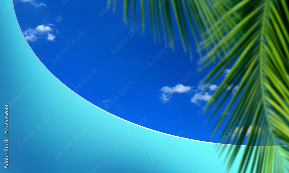 close up green palm tree leaf and textured empty blue wall over sunny blue sky