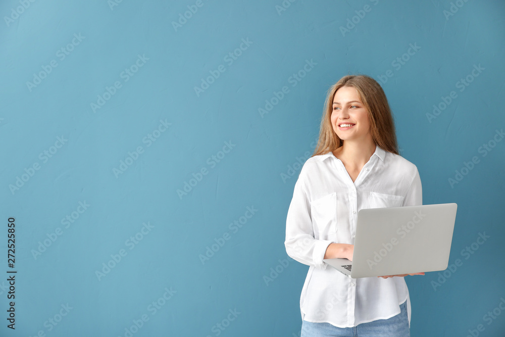 Beautiful young woman with laptop on color background Beautiful young woman with laptop on color background