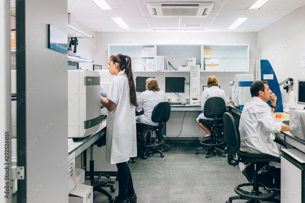 Biologists Working In A Laboratory