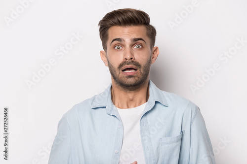 Guy feeling shortness of breath about emotional stress studio headshot