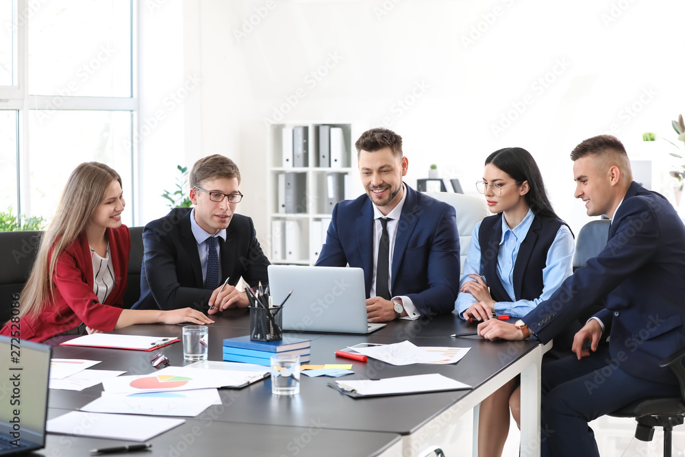 Team of business people during meeting in office Team of business people during meeting in office