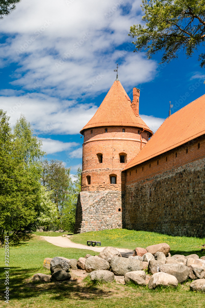 Trakai Island Castle in Lithuania, Eastern Europe. Tourists visit city castle. Famous ancient landmark Trakai Island Castle in Lithuania, Eastern Europe. Tourists visit city castle. Famous ancient landmark