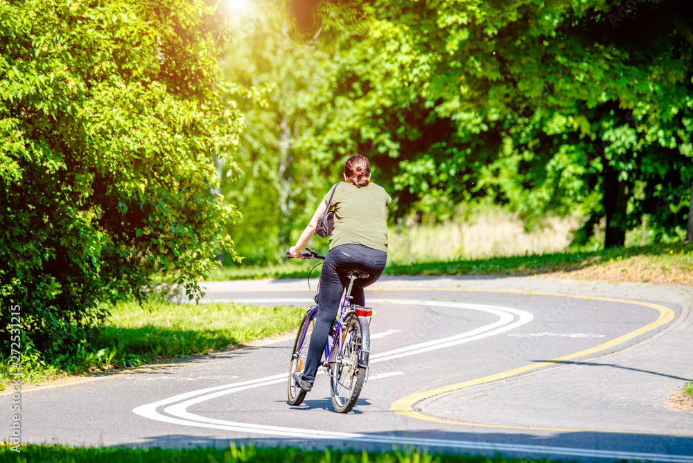 Cyclist ride on the bike path in the city Park 