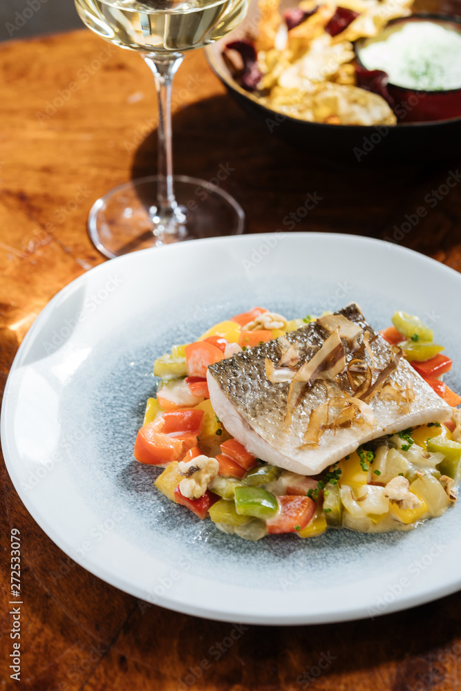 Fish with vegetables served on plate Fish with vegetables served on plate