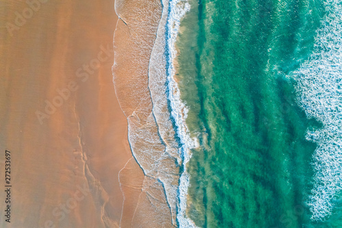 Aerial view of a wild beach at sunset