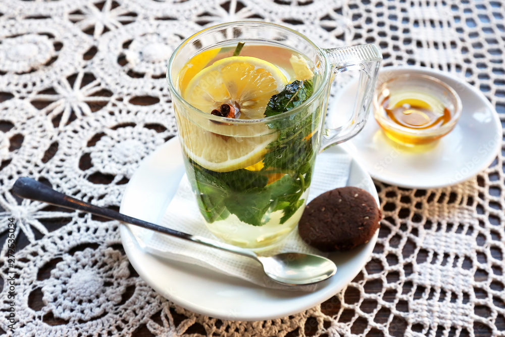 Cup of tea with lemon, mint, ginger and dessert Cup of tea with lemon, mint, ginger and dessert