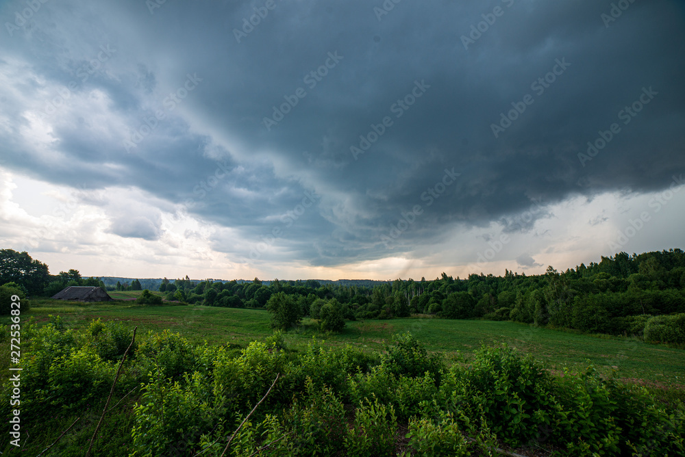 Fototapeta premium blue sky with white clouds over countryside landscape