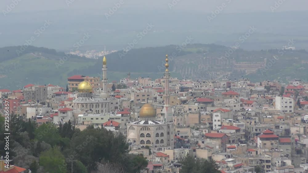 Mosques and minaret in Umm El Fahm, an Arab town with citizens of Israel. Umm al-Fahm is the social, cultural and economic center for residents of the Wadi Ara and Triangle regions. Mosques and minaret in Umm El Fahm, an Arab town with citizens of Israel. Umm al-Fahm is the social, cultural and economic center for residents of the Wadi Ara and Triangle regions.
