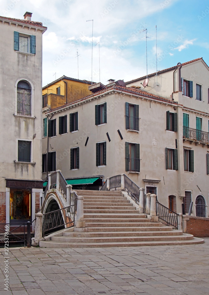 a footbridge crossing a canal in salizada dei greci in the castello area of houses and buildings in venice built in the 17th century as a greek district