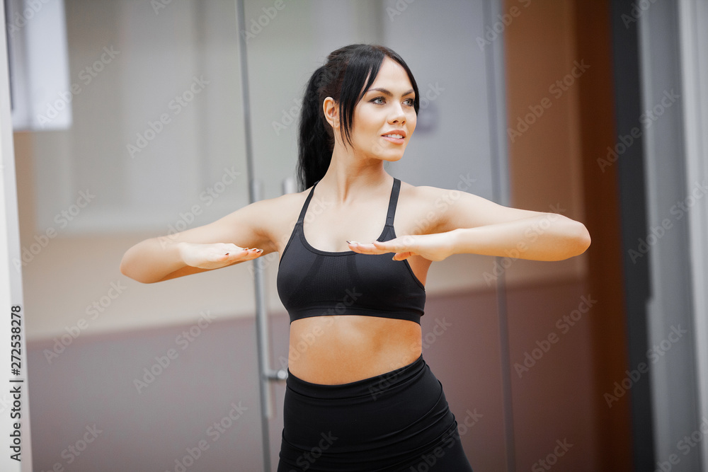 Healthy lifestyle. Fitness woman doing exercise in gym