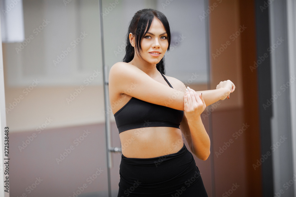 Healthy lifestyle. Fitness woman doing exercise in gym Healthy lifestyle. Fitness woman doing exercise in gym
