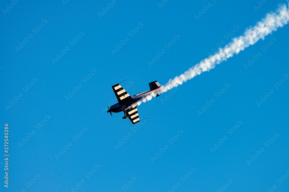 Airplane acrobatics in air show. Airplane acrobatics in air show.