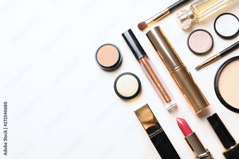 Obraz premium Different luxury makeup products on white background, top view
