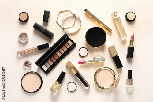 Set of luxury makeup products on color background, flat lay