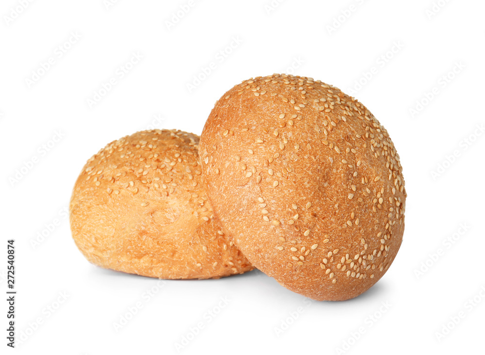 Fresh burger bun with sesame seeds isolated on white Fresh burger bun with sesame seeds isolated on white