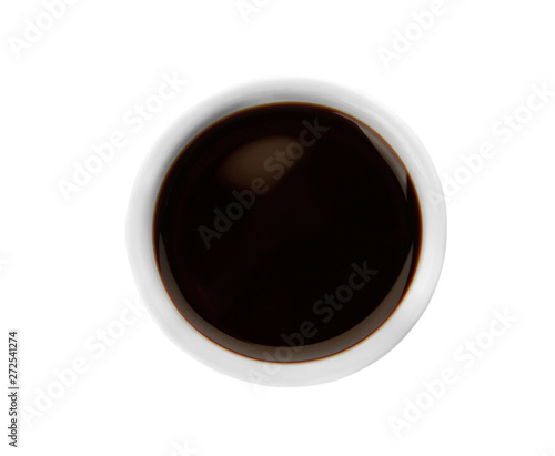 Bowl of tasty soy sauce isolated on white, top view