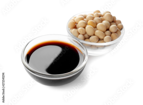 Bowl of tasty soy sauce and beans isolated on white