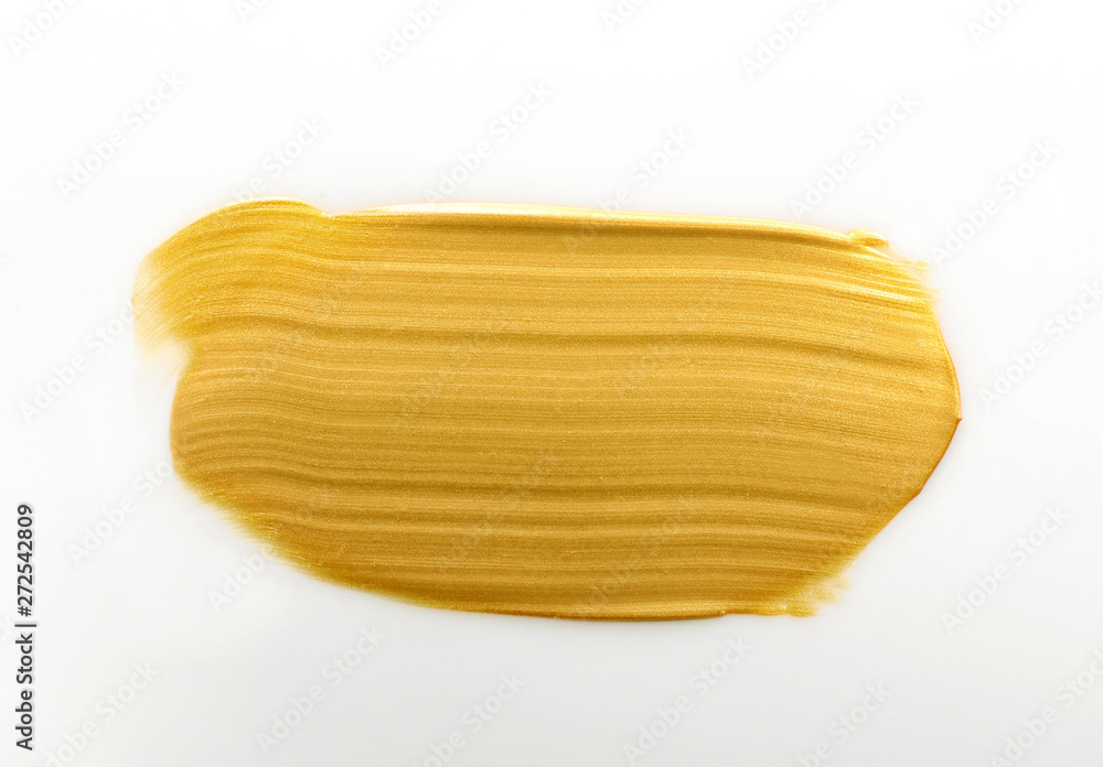 Stroke of gold paint isolated on white, top view