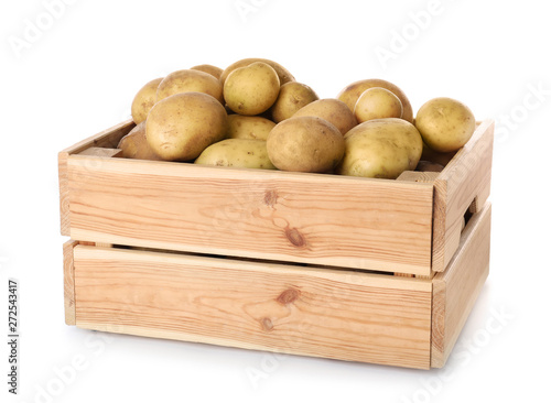Wooden crate full of fresh raw potatoes on white background © New Africa